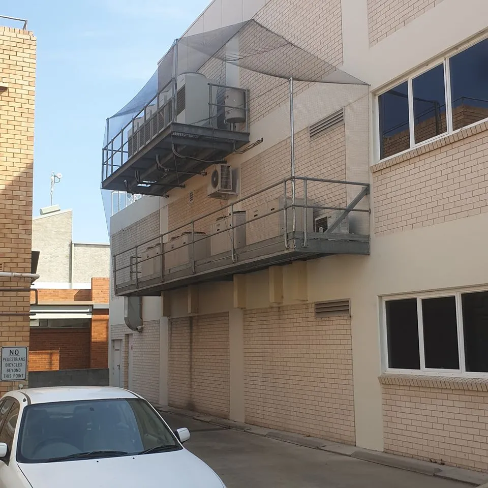 Bird-exclusion netting on a commercial building in Port Macquarie