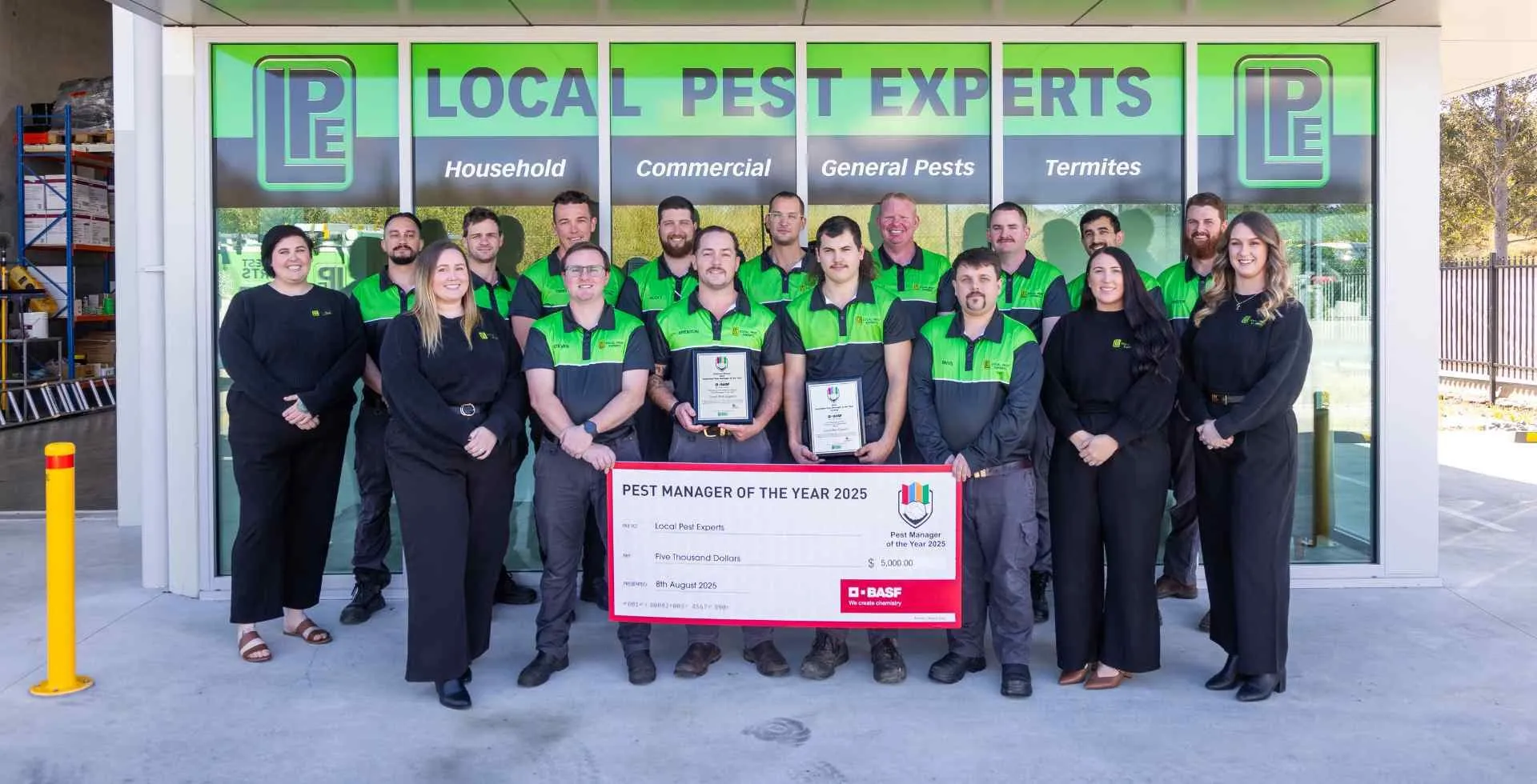 The Local Pest Experts team outside the Taree office holding the Pest Manager of the Year 2025 cheque and plaques