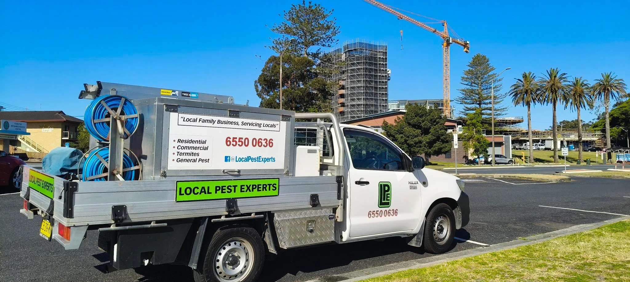 A Local Pest Experts ute in the car park of the Forster Neighbourhood Centre